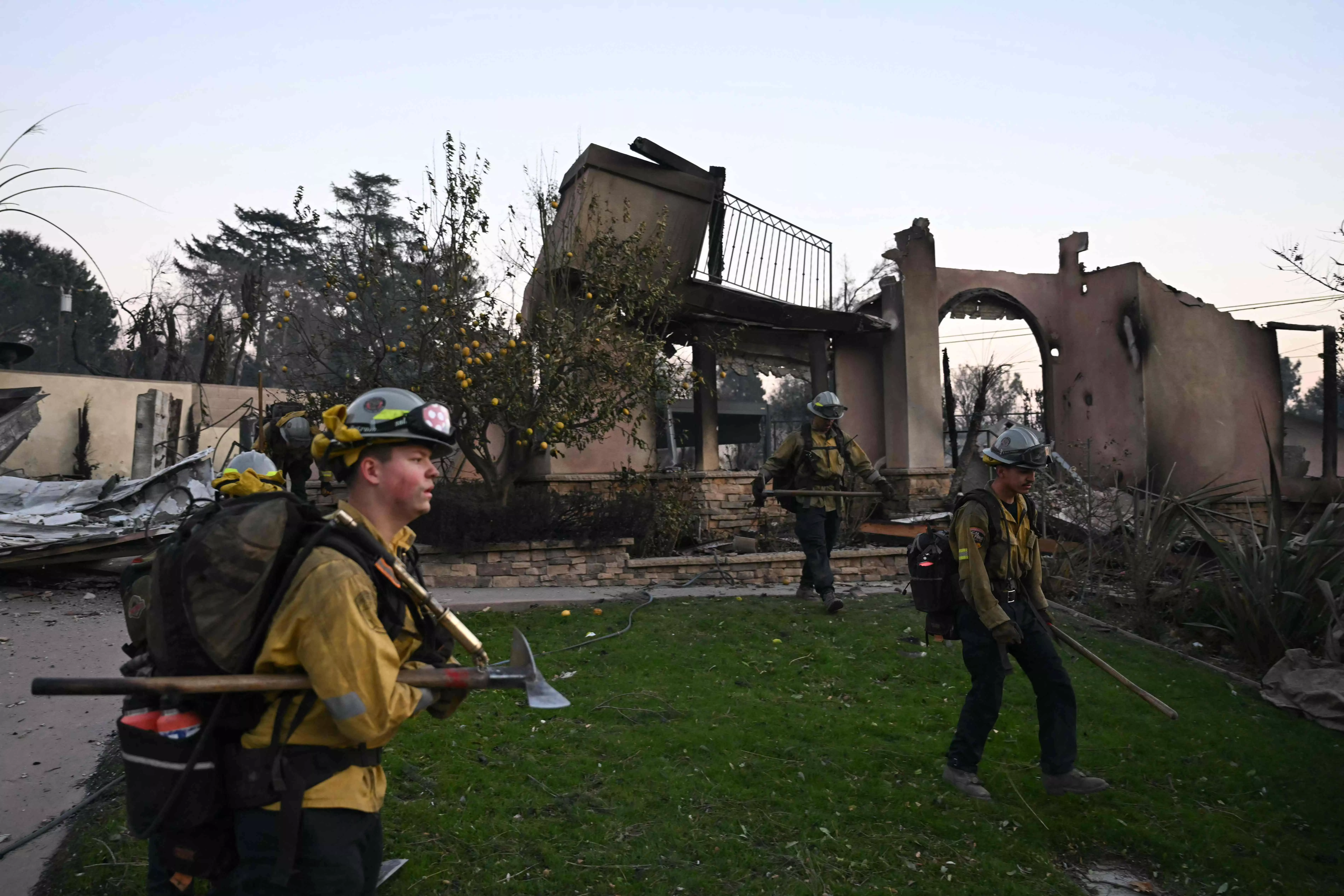 Wind lull offers hope in Los Angeles fires as blame game begins