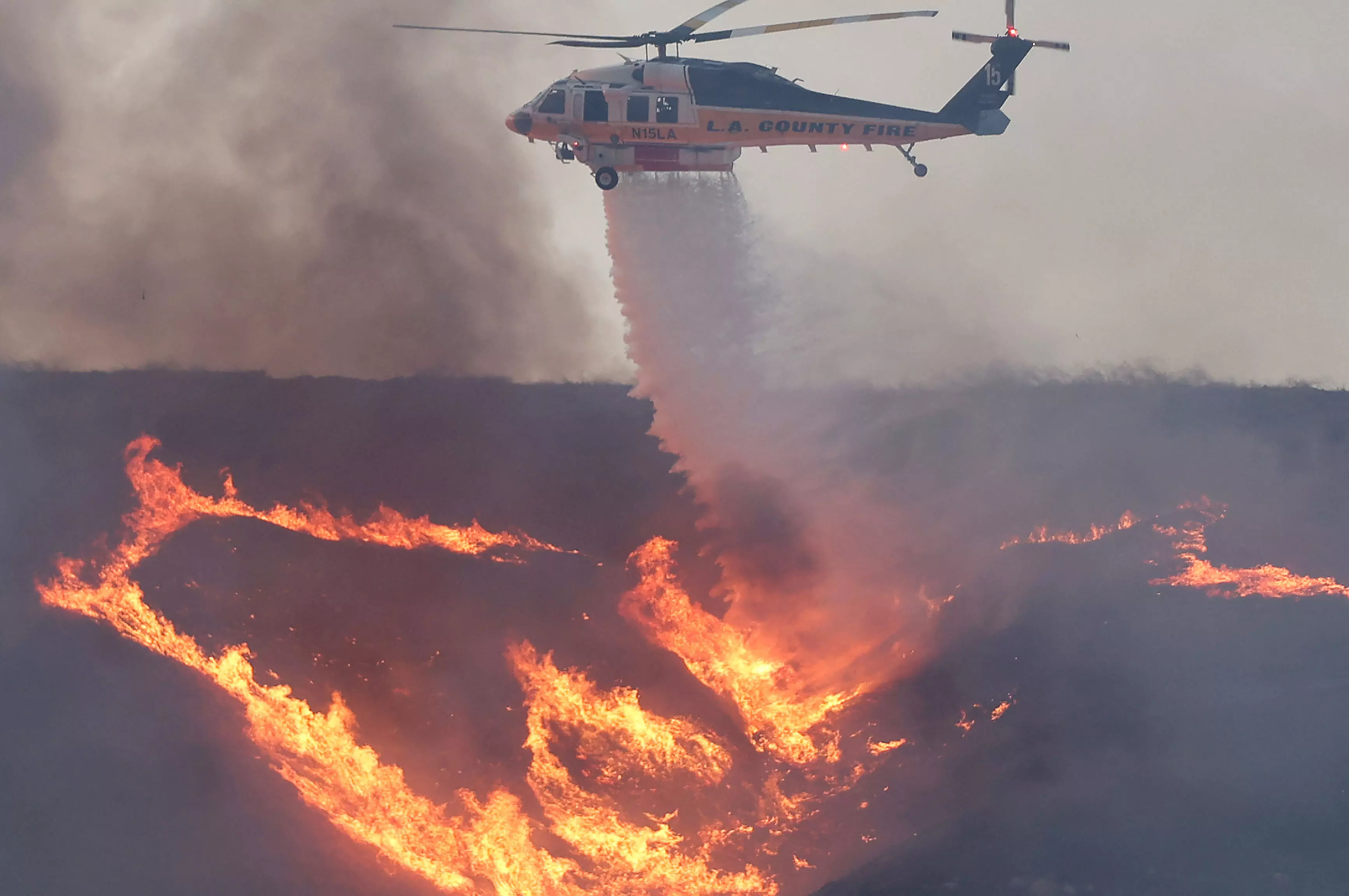 Mass evacuations after explosive new fire erupts near Los Angeles