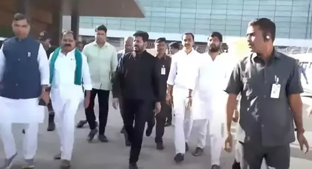 Revanth Reddy returns to Hyderabad after successful Davos tour