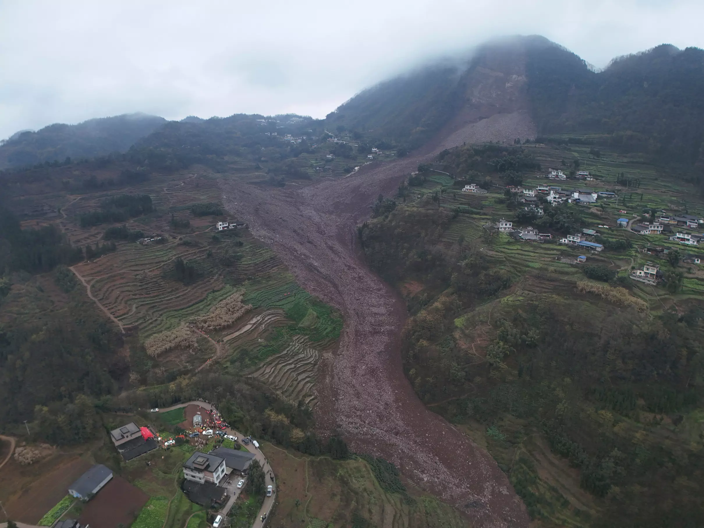 Rescuers search for at least 29 people after a landslide in China