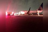 United airlines plane catches fire at Houston's Bush Airport