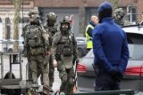 Belgian police hunting 2 suspects after Brussels shooting