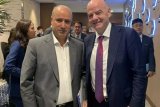 FIFA President Infantino congratulates Mehdi Taj