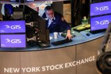 US stocks end higher after Powell remarks