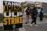 Thousands of US Amazon staff strike days before Christmas