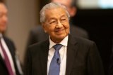 Malaysia's ex-PM Mahathir, 99, discharged from hospital