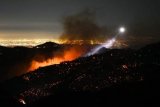 Strong winds return to whip up Los Angeles fires