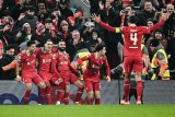 Liverpool's magnificent seven secures Champions League progress