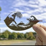 A Japanese artist finds solace and global fans with intricate leaf-cutting