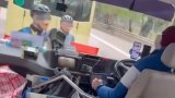 Hong Kong cyclists and minibus driver stop traffic with heated dispute