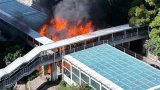 Fire engulfs and destroys part of large noise barrier on busy Hong Kong road