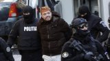 After 9 months on run, French fugitive who staged deadly escape faces court in Romania