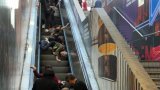 Mainland Chinese tourists fall down Hong Kong escalator ‘like dominoes’